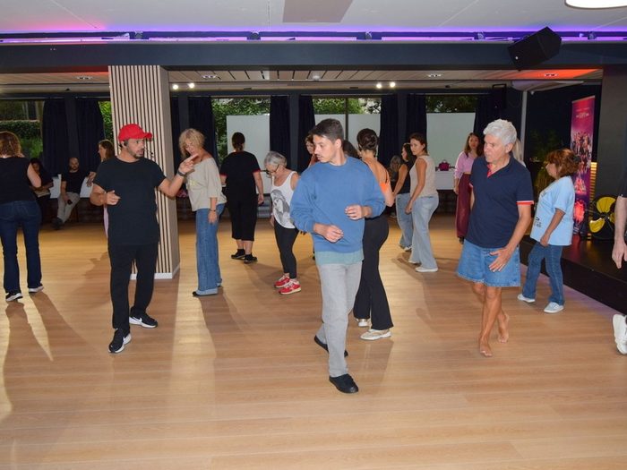 Group salsa class in the main room