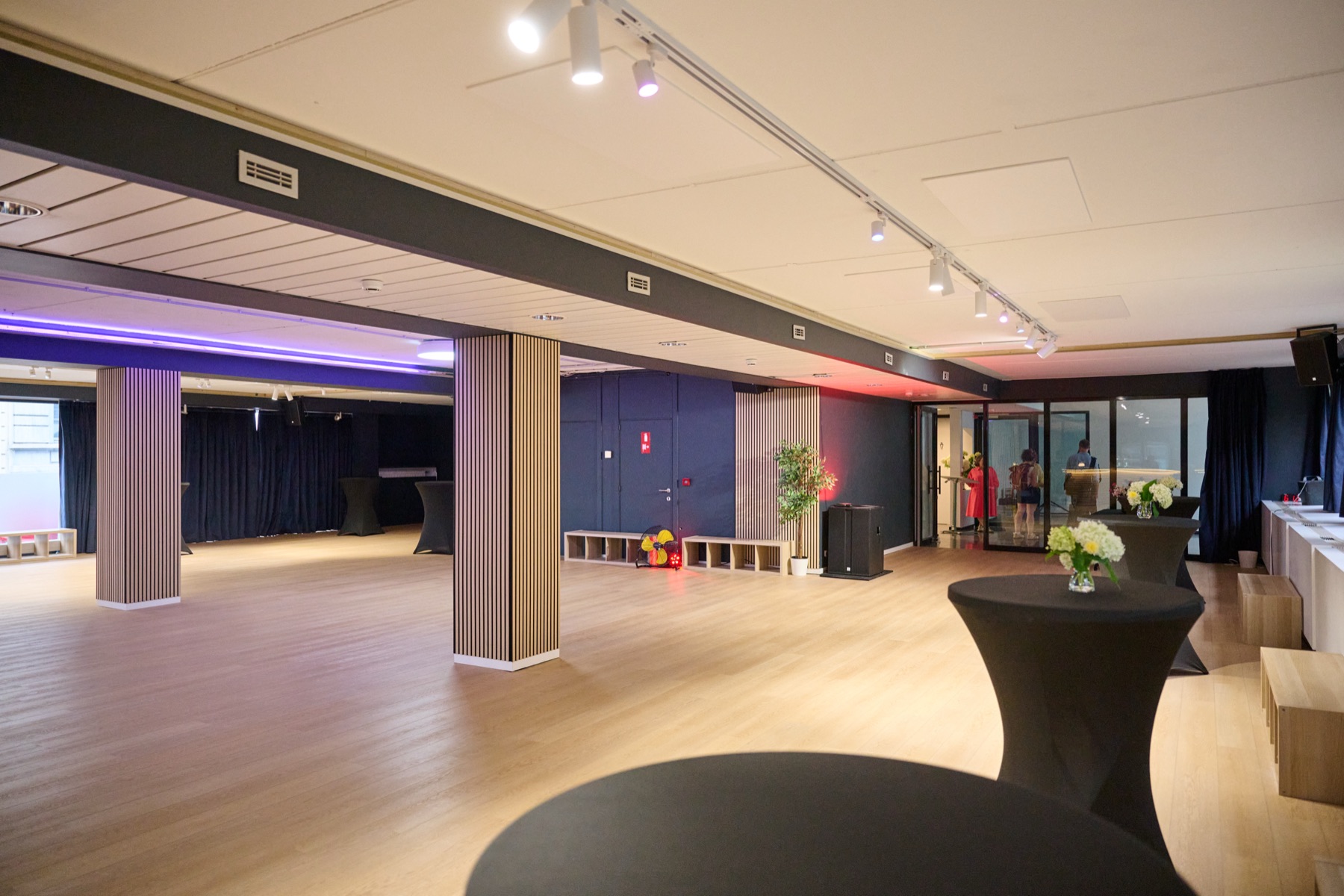 The main room at Studio 28 under purple light, set for an evening class