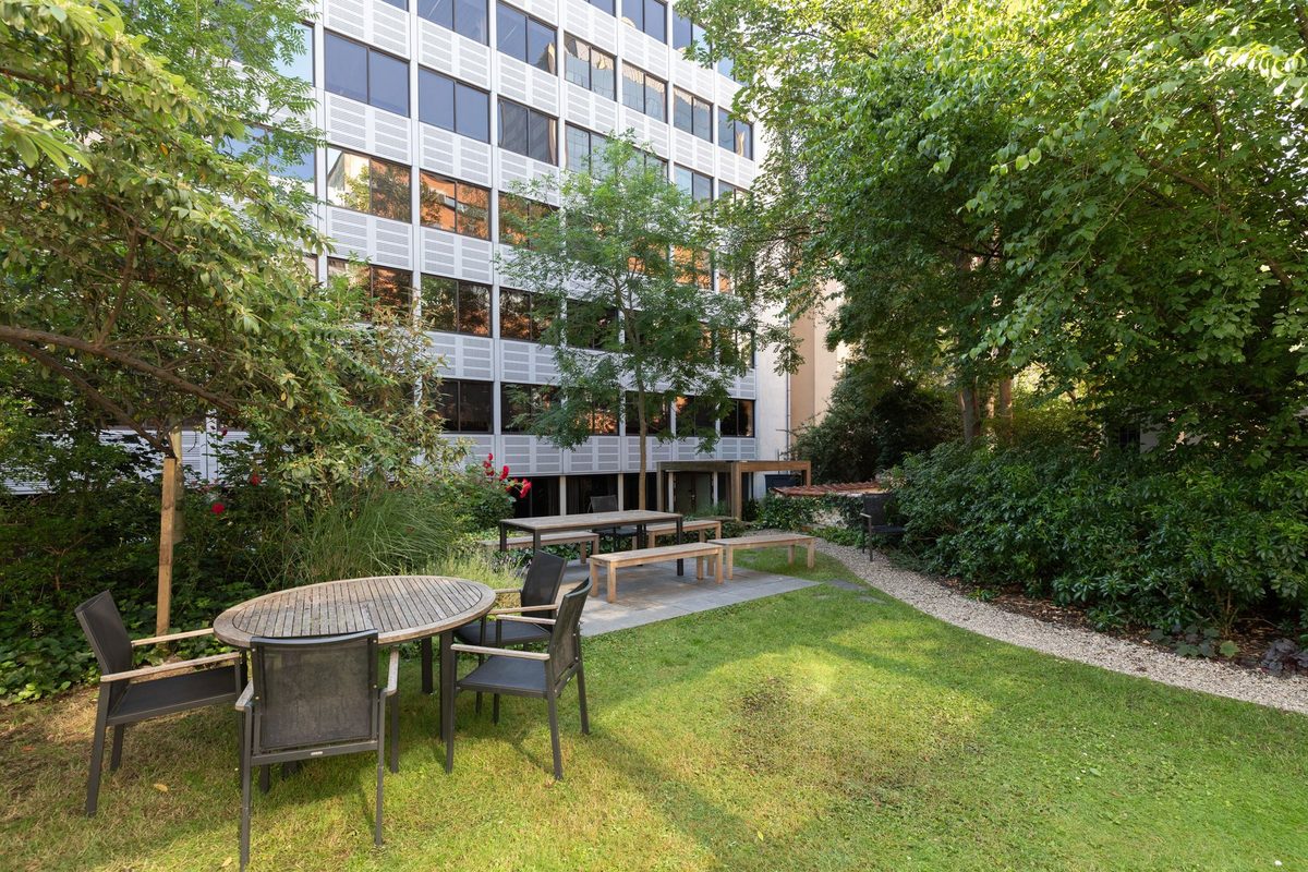 Teak tables and chairs on the garden lawn